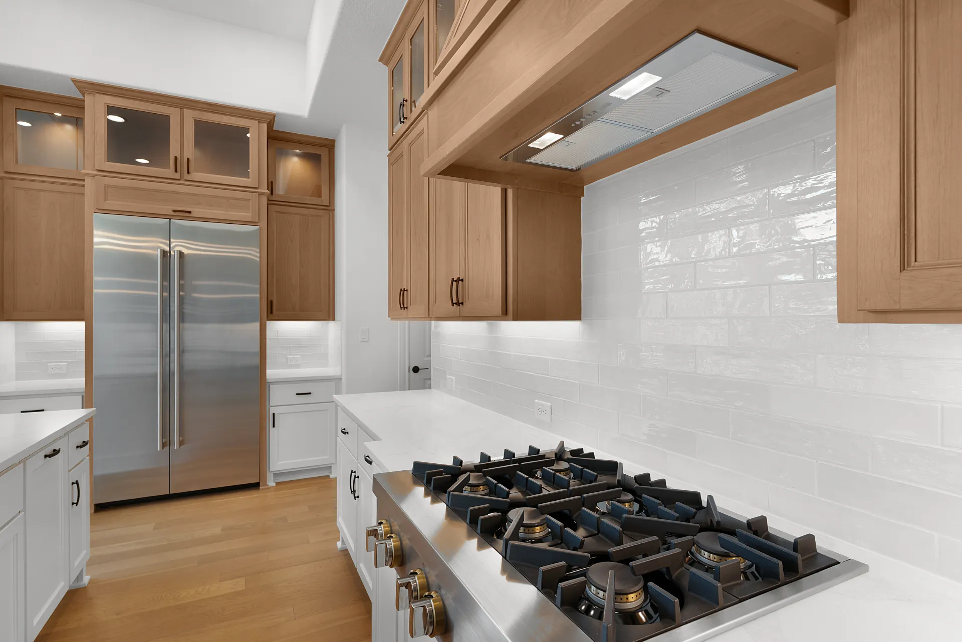 Built-in refrigerator and freezer with cooktop wall