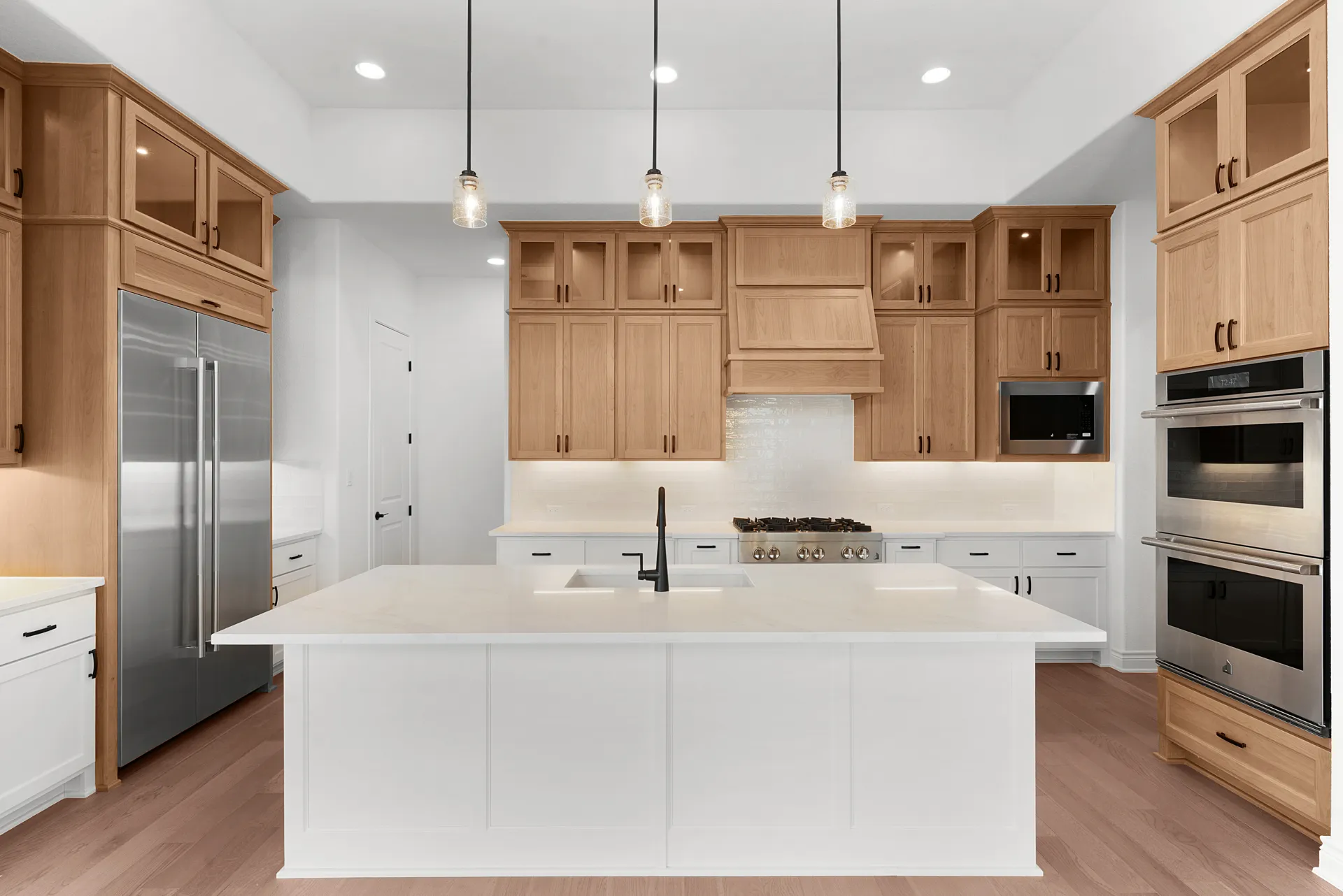 Gourmet kitchen with oversized island and JennAir appliances